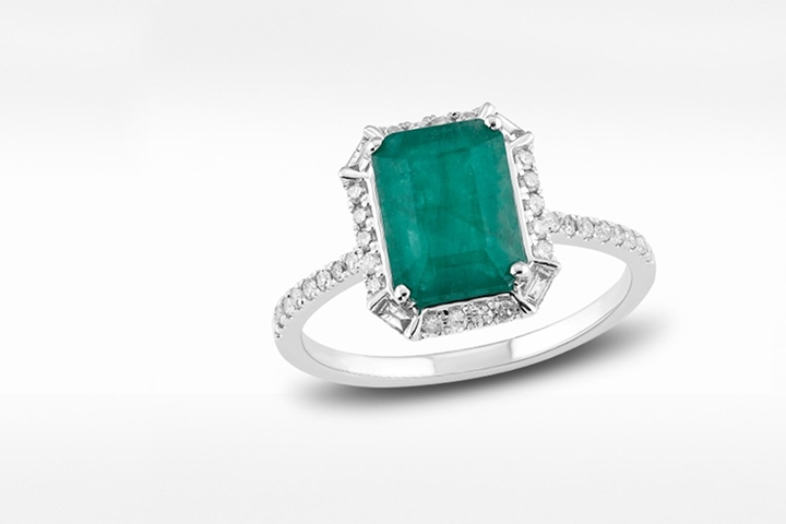 Emerald and diamond engagement ring in white gold